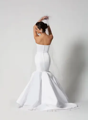White wedding dress side view on white background, softgoods photography