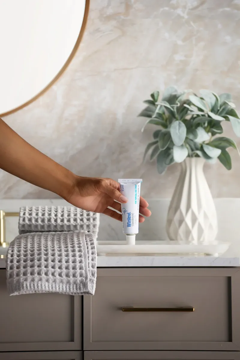 Winlevi skincare bathroom scene lifestyle