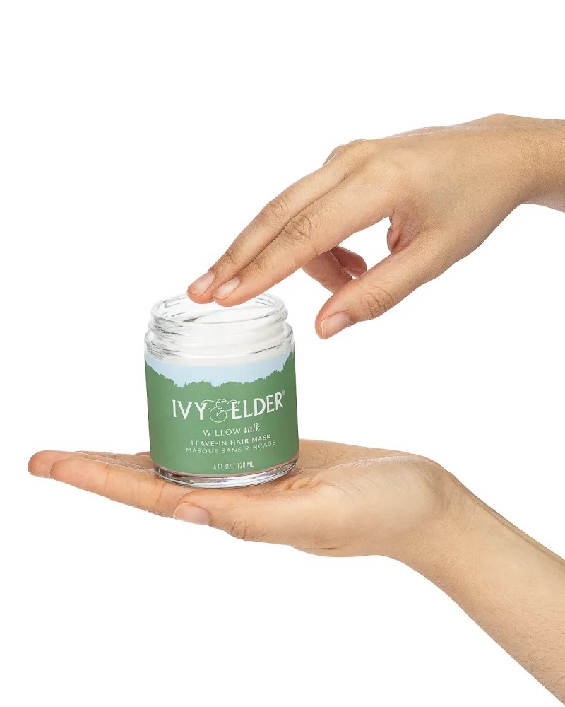 Ivy and Elder Willow Talk leave-in hair mask held in hand, commercial beauty photography
