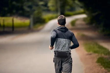 Jogger running with water bottle lifestyle shot