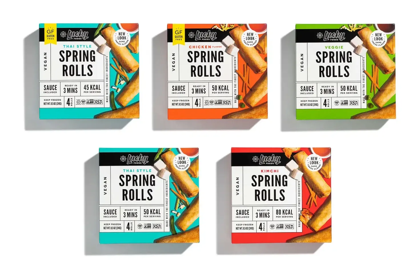 A group of Lucky Foods spring roll packages arranged on a tabletop for ecommerce catalog photography.