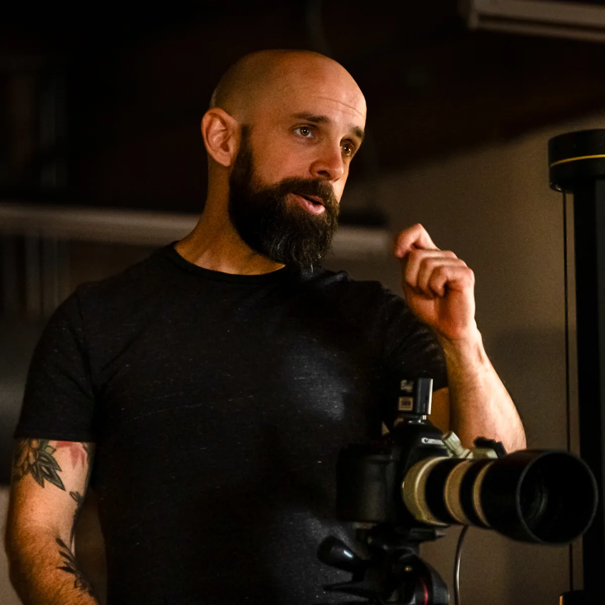 Paul Zimmerman giving direction to a model from behind the camera during a product shoot for WithMe